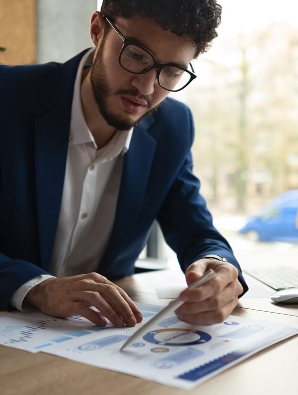 people-analyzing-checking-finance-graphs-office